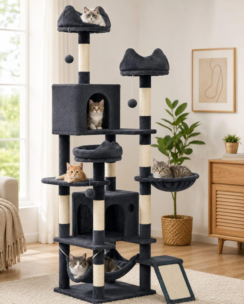 Large multi-level indoor cat tree with scratching posts, plush perches, condos, hammock, and hanging toys being used by multiple cats.